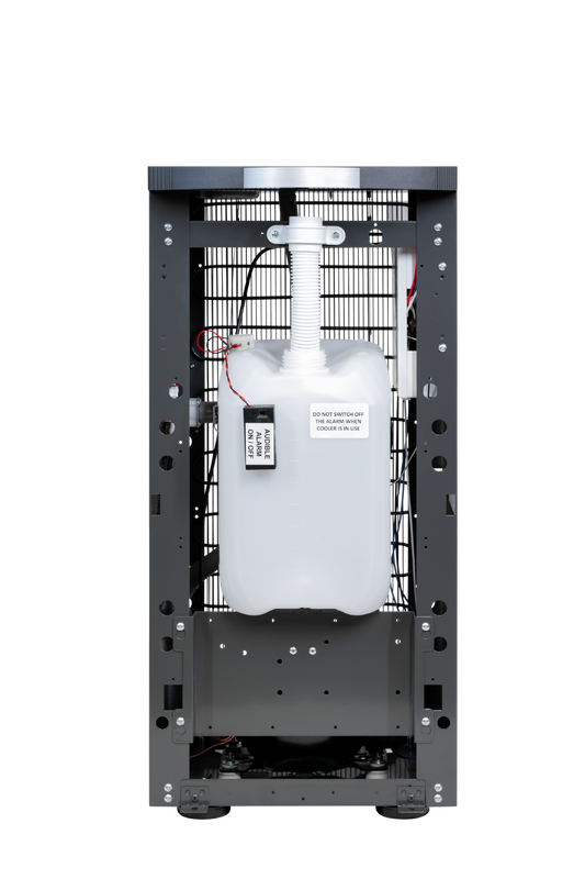 OVERFLOW10 drainage kit shown installed inside a dispenser cabinet; dispenser not included